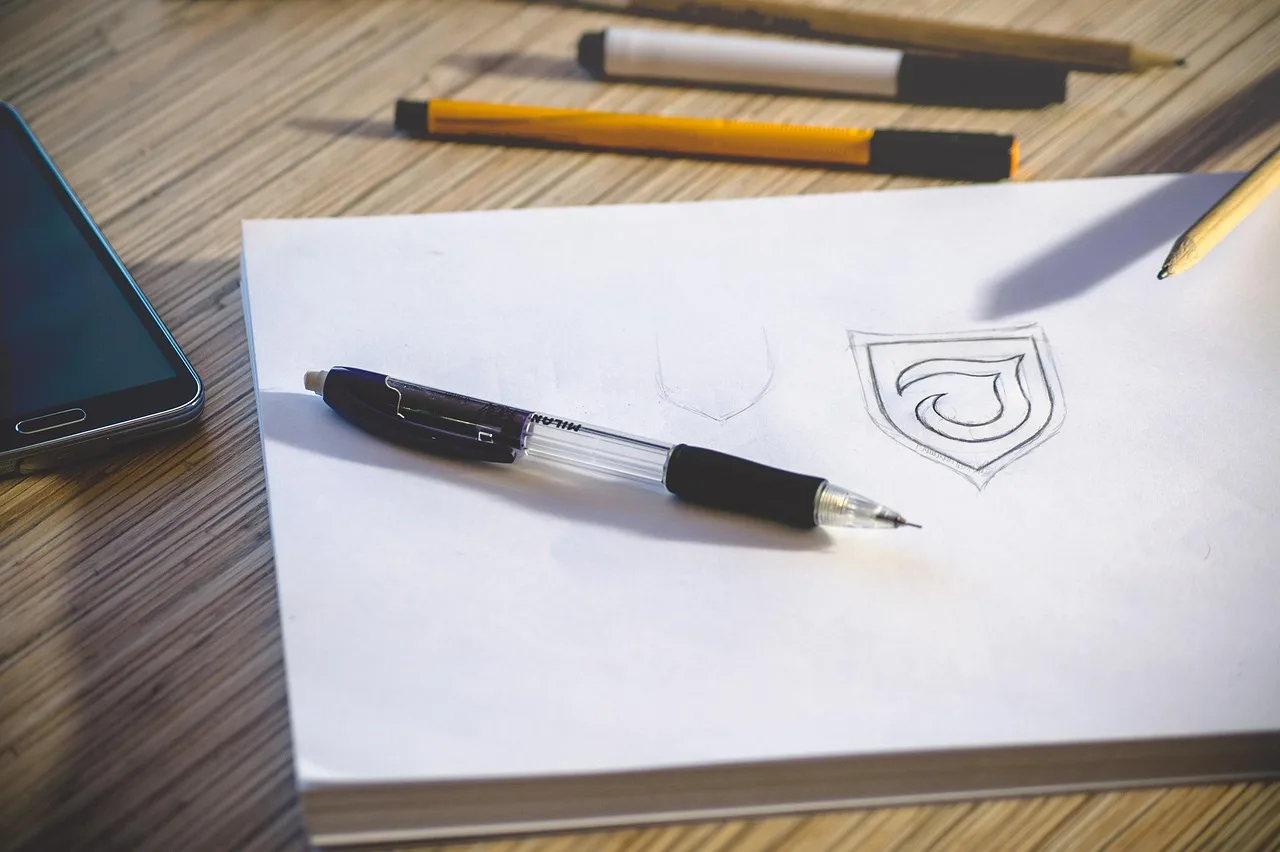 desk, workspace, pencil, paper, logo, sketch, work, office, office desk, workplace, table, document, notebook, drawing, designing, pens, white paper, logo, logo, logo, logo, logo. Celebrity Baby Name Trademark: USPTO Rules vs Reality
